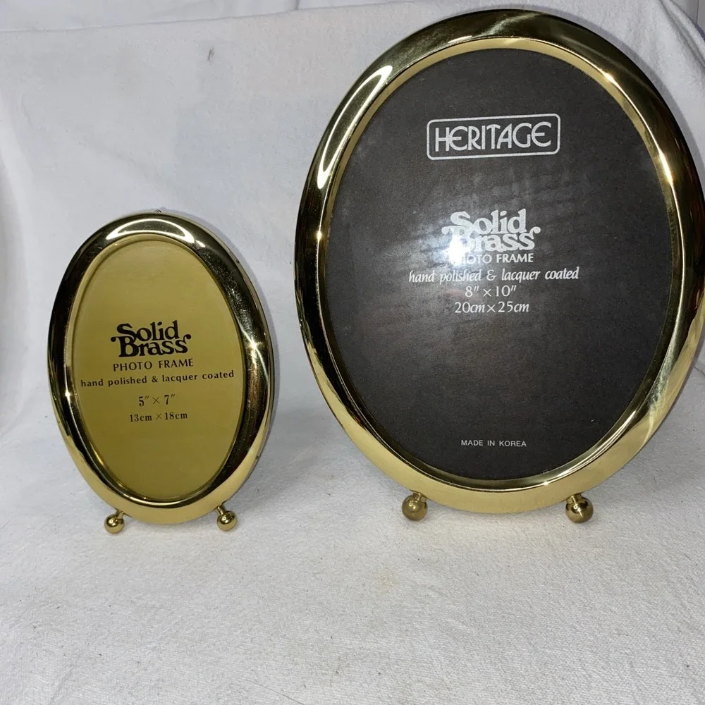 2 Solid Brass Oval Pictures Frames. One 5x7